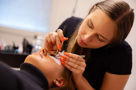 Beautician Using Tweezers For Eyelash Extension Treatmentの写真素材