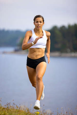 Athlete Sprinting High-Intensity Intervall Workout in Beautilful Natureの写真素材