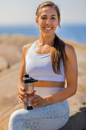 Confident Female Resting After Exercising Outdoorsの写真素材