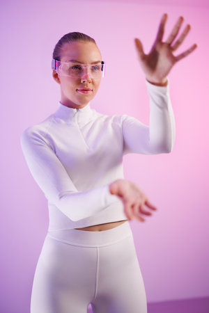 Woman in smartglasses standing in studioの写真素材
