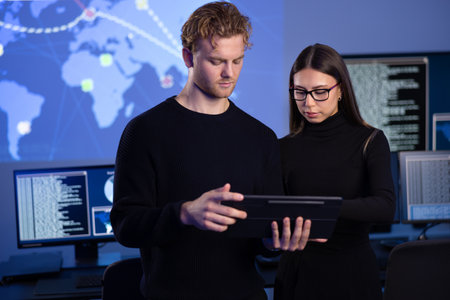 Focused professional cyber security team working to prevent security threats, find vulnerability and solve incidentsの写真素材