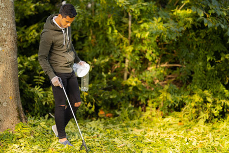 Committed volunteer conserving environment from pollution and plastic
