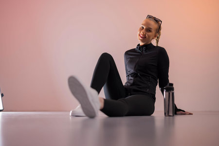 Smiling woman relaxing after workout