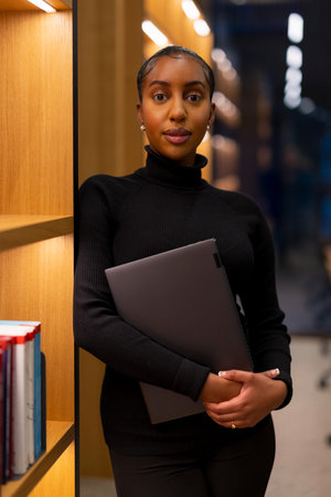 Student studying at a modern library