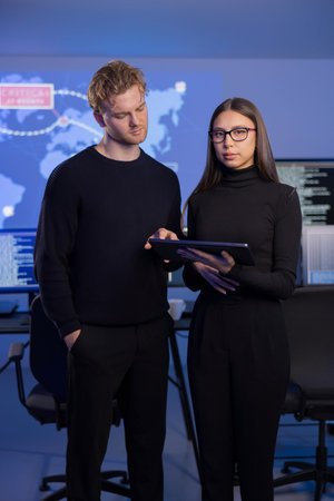 Professional analysts investigate cybersecurity incidents in advanced control room environment