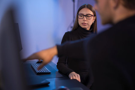 Team collaboration in a modern tech ambiance with focused interactions