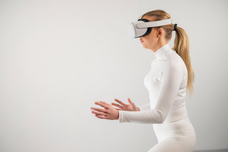 Woman Experiencing Virtual Reality Simulationの写真素材