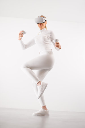 Female in VR glasses practicing martial artsの写真素材