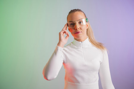 Woman in futuristic eyeglasses posingの写真素材
