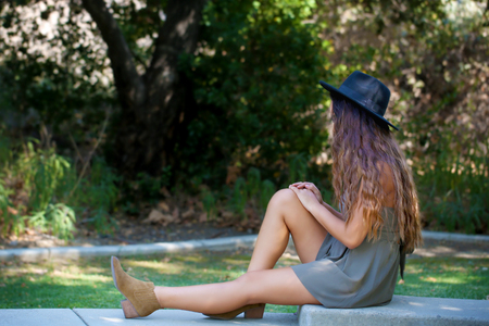 Girl sitting and thinkingの写真素材