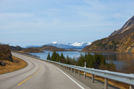 Snowcapped mountains and blue water, Norwegian fjordの写真素材