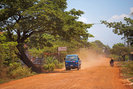 Truck on dusty road in Treak village, Siem Reapのeditorial素材