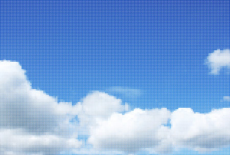 Halftone dot background of sunshine in a blue sky with fluffy white cloudsの写真素材