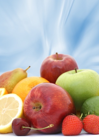 Display of fresh fruit on abstract blue backgroundの写真素材