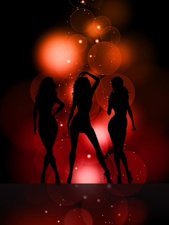 Silhouettes of sexy females on a glowing lights backgroundの写真素材