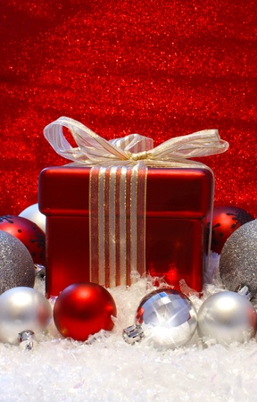 Christmas gift and decoratiions in snowの写真素材