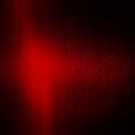 Red brushed metal background with a grunge effectの写真素材