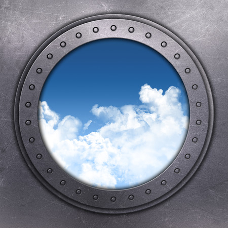 3D render of a port hole looking out onto blue skyの写真素材