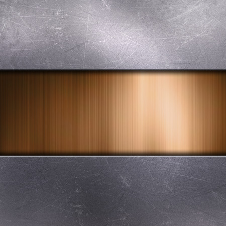 Scratched metallic background with gold metalの写真素材