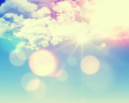 Sunny blue sky background with fluffy white clouds and retro effect added