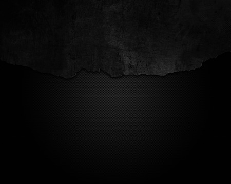 Cracked grunge on a carbon fibre backgroundの写真素材