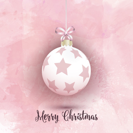 Hanging Christmas bauble on a pink watercolor backgroundの写真素材