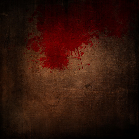 Dark grunge style background with blood splattersの写真素材