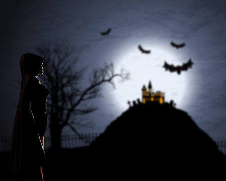 3D render of a female in cloak against a defocussed Halloween background