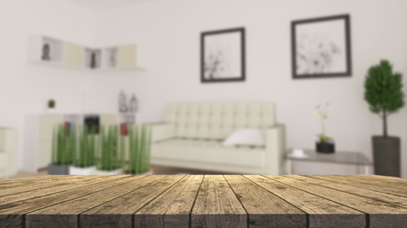 3D render of a wooden table looking out to a defocussed modern living roomの写真素材