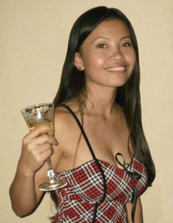Pretty Woman Enjoying a Glass of Wineの写真素材