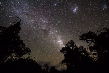 Long exposure of the night sky showing the clouds of the Milky Way Galaxy, the Large Magellanic...