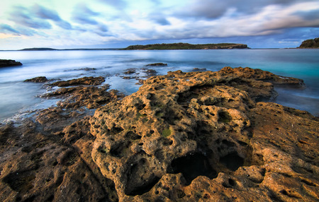 Long exposure of the ocean as seen from a rocky coastline at Jervis Bay National Park, New South Wales, Australia.の写真素材