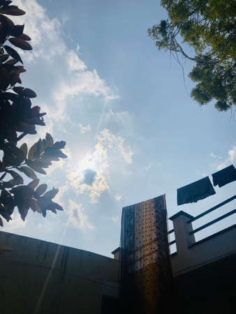 Low angle view of the blue sky with white clouds.の写真素材