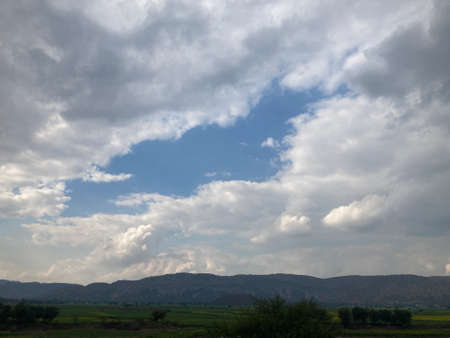 Clouds over the fields of the Galilee in Israelの写真素材