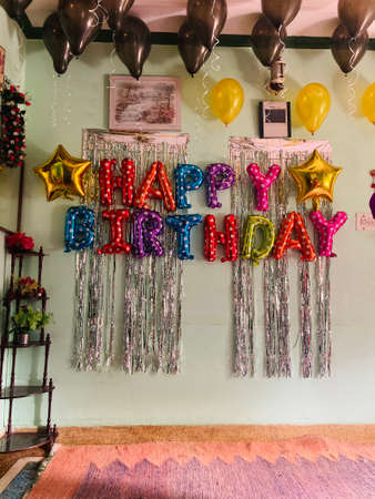 A variety of colorful balloons and ribbons for a birthday party.の写真素材