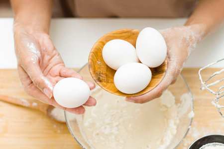 on the table are eggs, salt, flour, and dough. Preparation of the bread