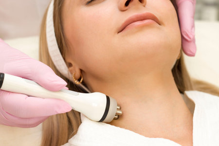 portrait of a young beautiful girl rf face lifting procedure. Face care and rejuvenation. Increased...