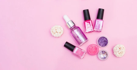Top view of manicure, pedicure materials, on a pink background
