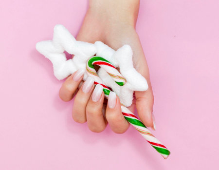 Beautiful gradient manicure. Christmas decorations in your hands. New Year's manicure conceptの写真素材