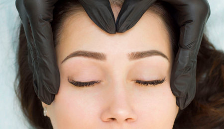 Young woman with beautiful eyebrows, close-upの写真素材