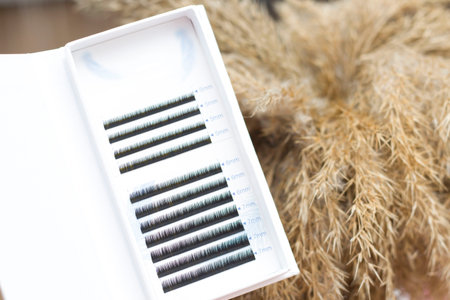 eyelash extensions. Eyelashes for extension, tweezers