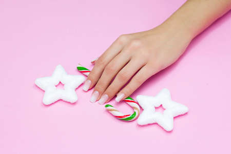 Beautiful gradient manicure. Christmas decorations in your hands. New Year's manicure conceptの写真素材