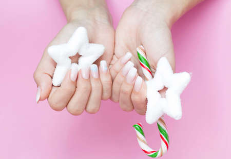 Beautiful gradient manicure. Christmas decorations in your hands. New Year's manicure conceptの写真素材