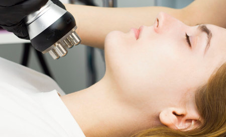 Cosmetology. The cosmetologist makes the procedure of laser hair removal.