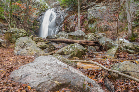 A beautiful waterfall makes a dramatic scene inside a hidden canyon on the top of  mountain.の写真素材