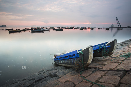 Qingdao, China folk raft fishing boat on the wharfの写真素材