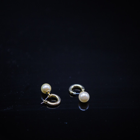 Pearl Earrings on dark backgroundの写真素材