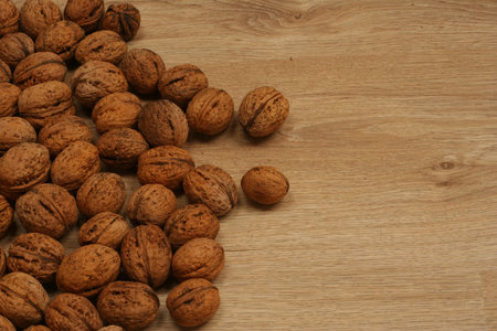 Scattered walnuts on the wooden floor