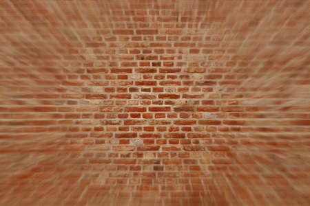 Blured brick wall horizontal background with red, orange and brown bricksの写真素材