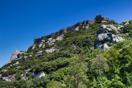 The hill with Arabian moorish castle on the top. Summer picture with blue sky. Sintra, Portugal.の写真素材